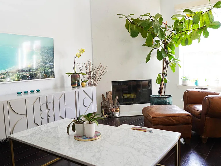 1st floor living room and white marble fireplace