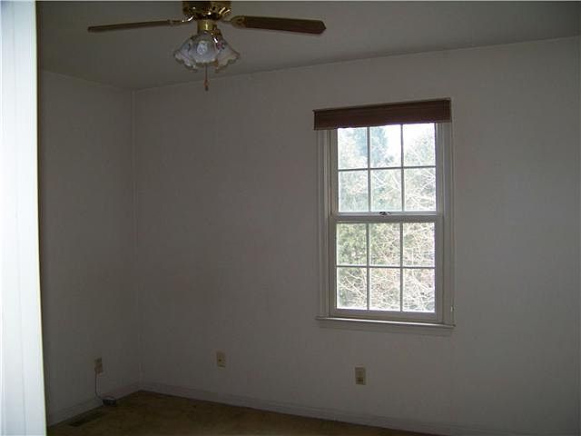 Hall Bathroom with Double Vanity and Tile Flooring