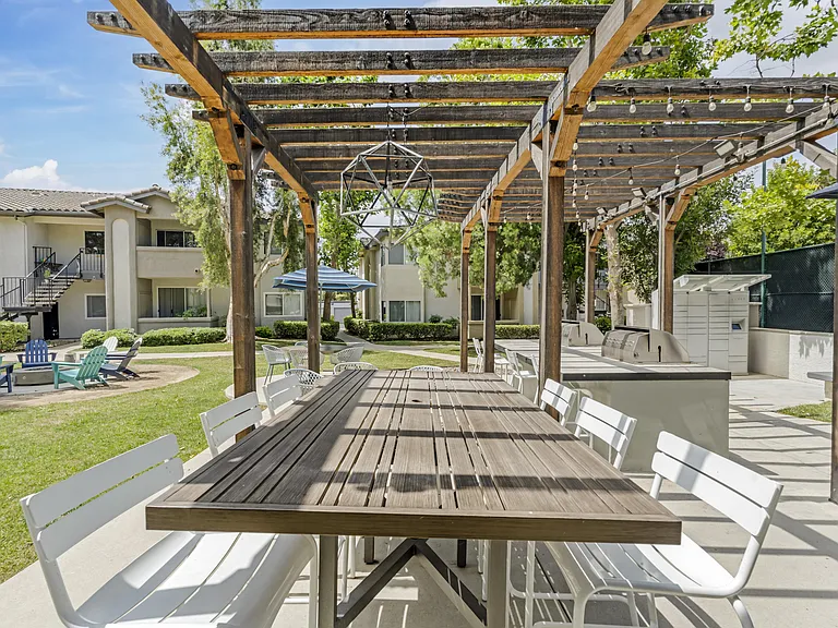 Right next to the grills at The Summit, there's a spacious table that seats eightperfect for enjoying meals and good company outdoors.