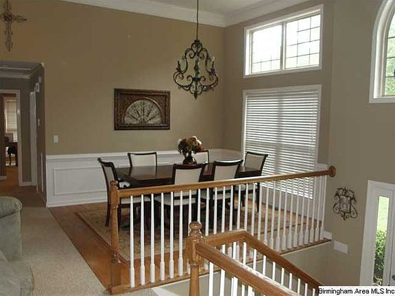 Formal Dining Room with Hardwood Floor and High Ceiling
