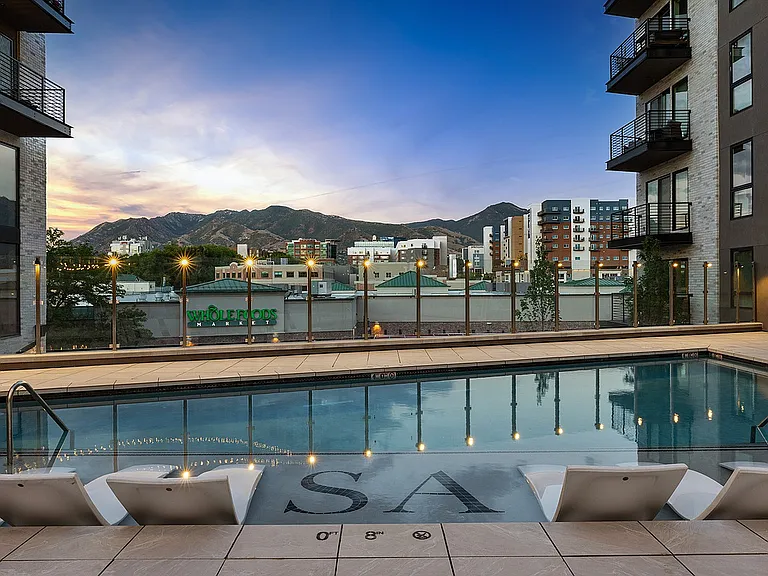Evening view of the pool with reflections and soft lighting