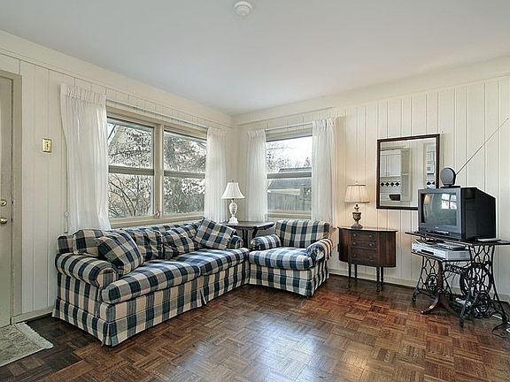 Family Room Open Up to Lush Landscaping and Deck