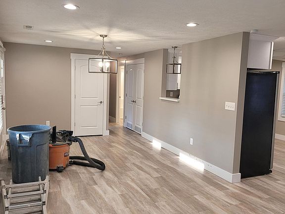 Step in off the front porch into a spacious, open Dining Room, completely open to the Great Room and with an large open window looking into the kitchen - complete with new Shaw waterproof vinyl plank flooring.