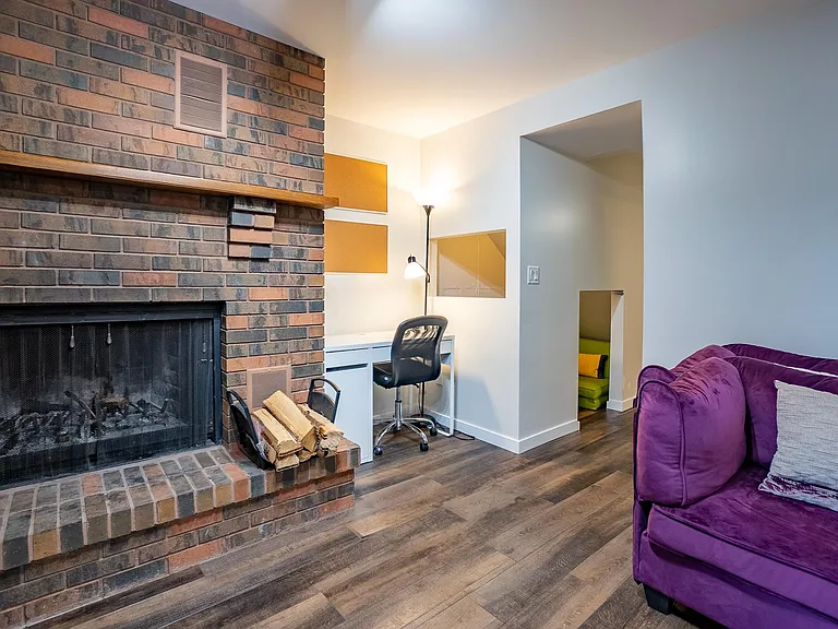 Office area. Understairs is either storage, kid fort, or even a spot for a person to sleep.