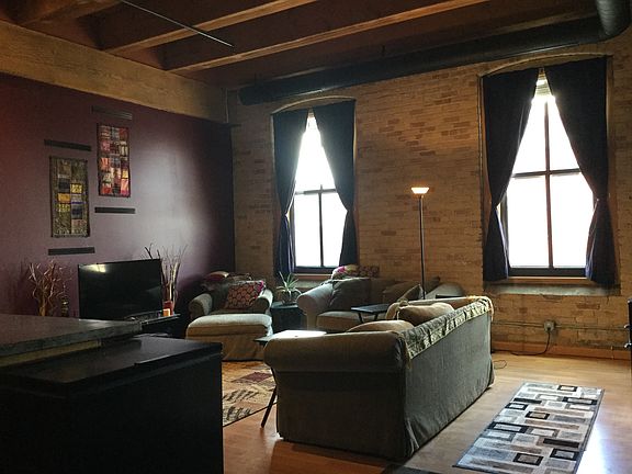 Living room windows with partial blackout curtains