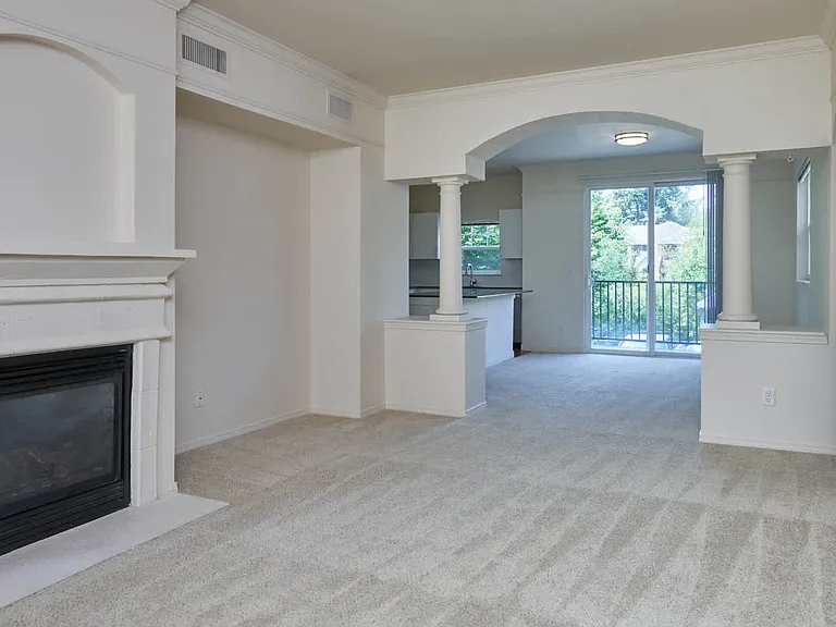 Carpeted Living Room with Fireplace