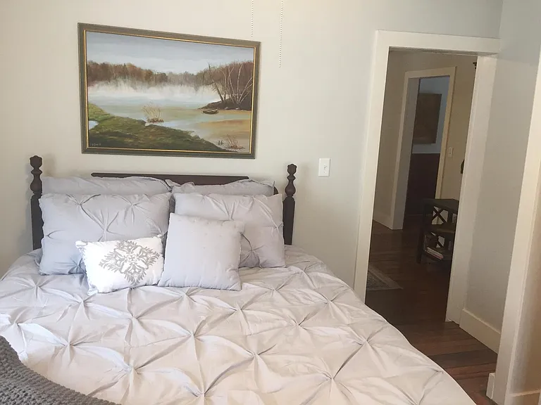 Queen size foam mattress.
Bathroom is located in the bedroom.
