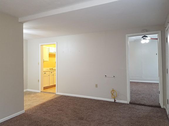 Living room looking towards the kitchen and the bedroom.