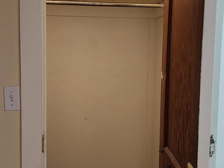 Front closet off dining room, next to front bedroom