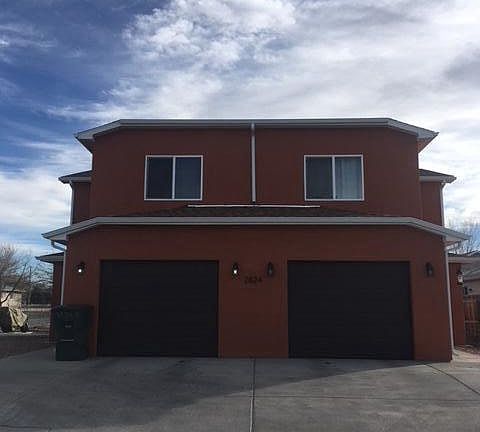 Unit A is on the left. Single car garage with gravel lot als