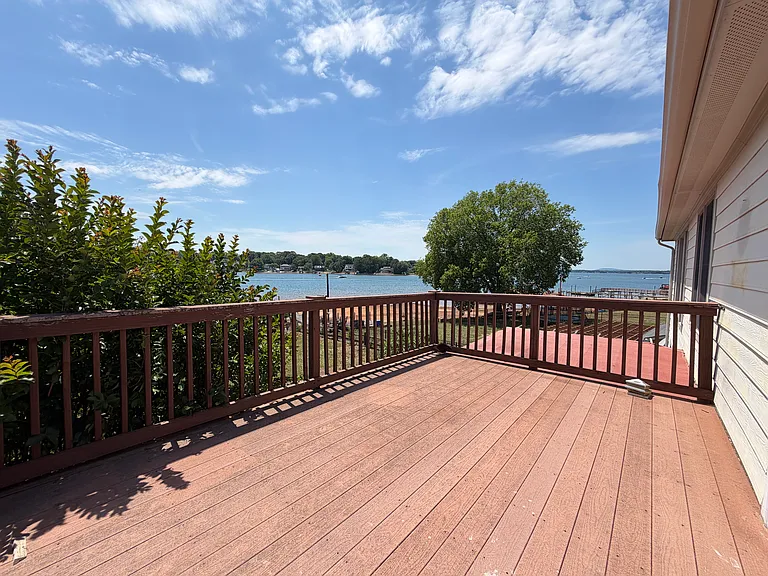 Step directly from the primary bedroom onto this sprawling deck_your private lakefront lounge for stargazing, morning yoga or weekend brunches with views.