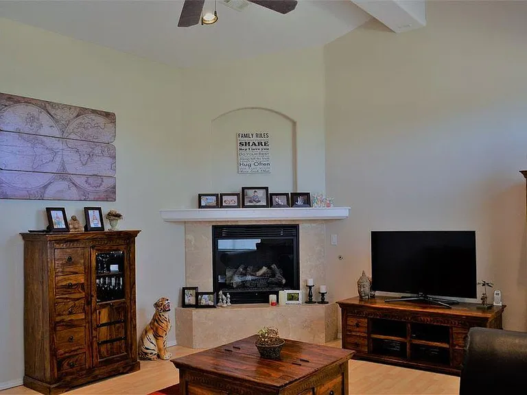 Living Room with gas fireplace, recessed lighting, surround sound hook-ups, and cathedral ceiling.