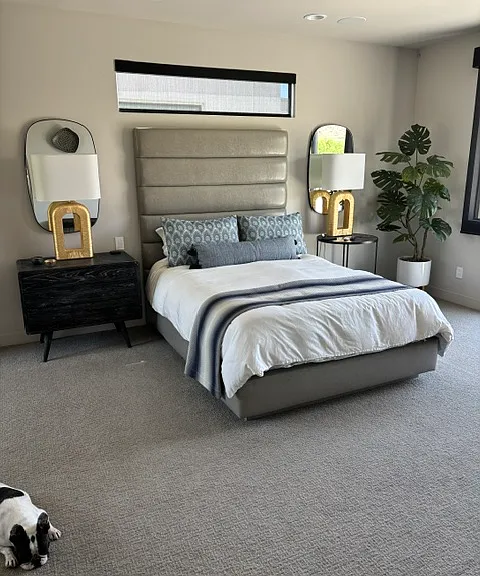 Primary bedroom with queen bed, night stands and lamps, balcony, motorized blinds, view (french bulldog not included)