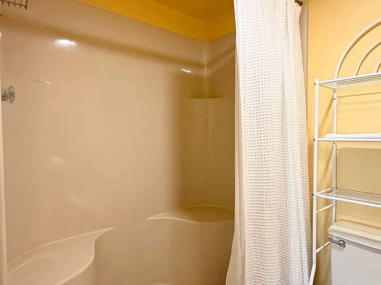 Primary walk-in shower w/ a seat!