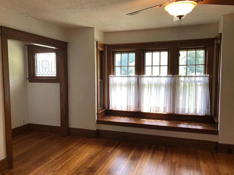 Living Room, nook on left, and bay window.