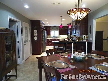 updated kitchen
						:
						large kitchen with wine cooler, large pantry, cherry cabinets, large prep spaces