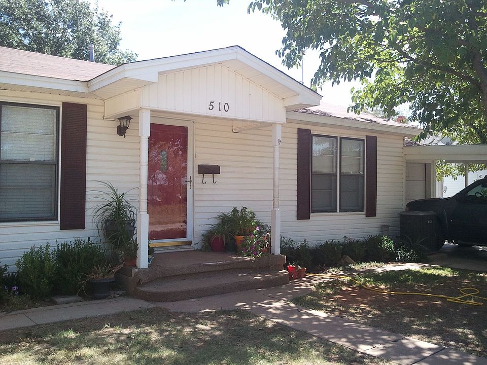 front w/garage & car port