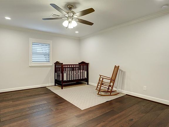The spacious secondary bedroom with gleaming wood floors is just waiting for your personal touch.