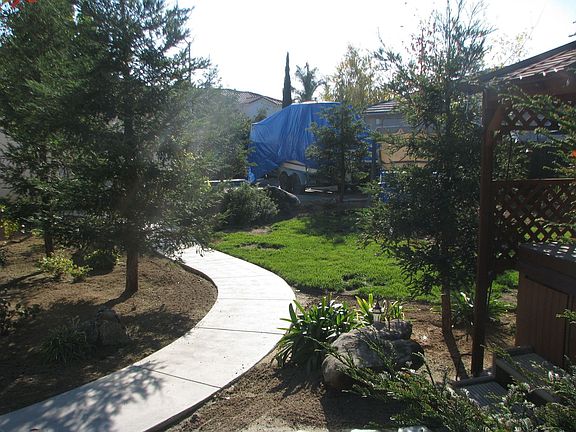 Side yard with RV area/Storage Shed