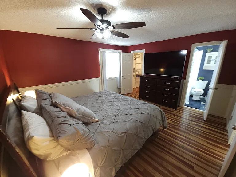 Walk in closet in master suite. Visio smart TV with Roku