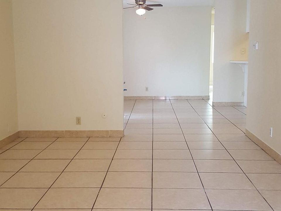 the living room leads to dining room kitchen
