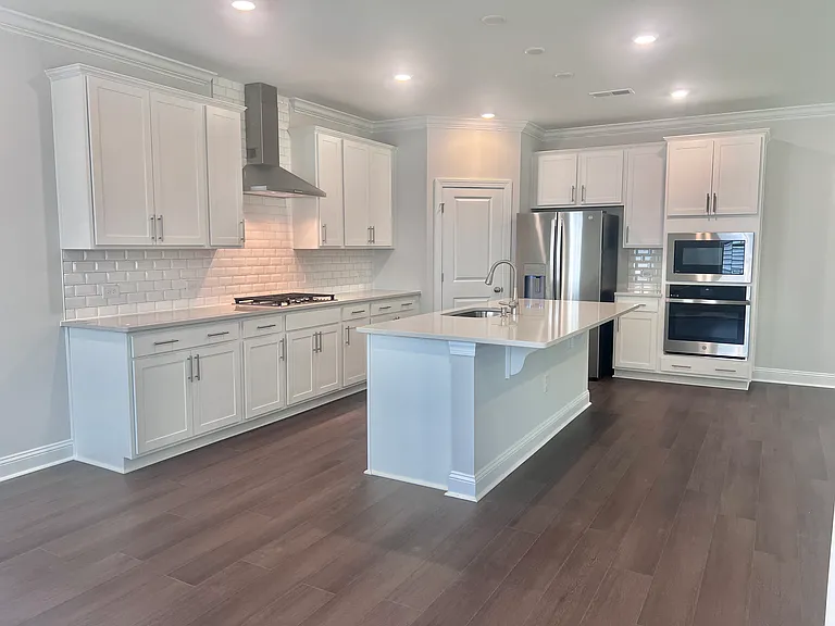 Upgraded Gourmet Kitchen w/Gas Cooktop, quartz countertops, walk-in Pantry, wall oven and microwave, etc