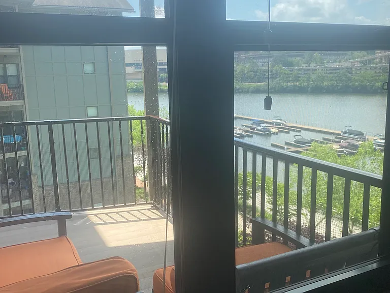 view from a bedroom to the balcony and river