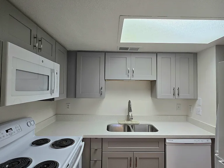 Updated kitchen with soft close cabinets, newer appliances, and quartz countertop.