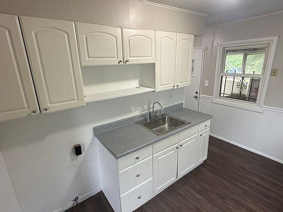 Kitchen window to covered back sunroom
