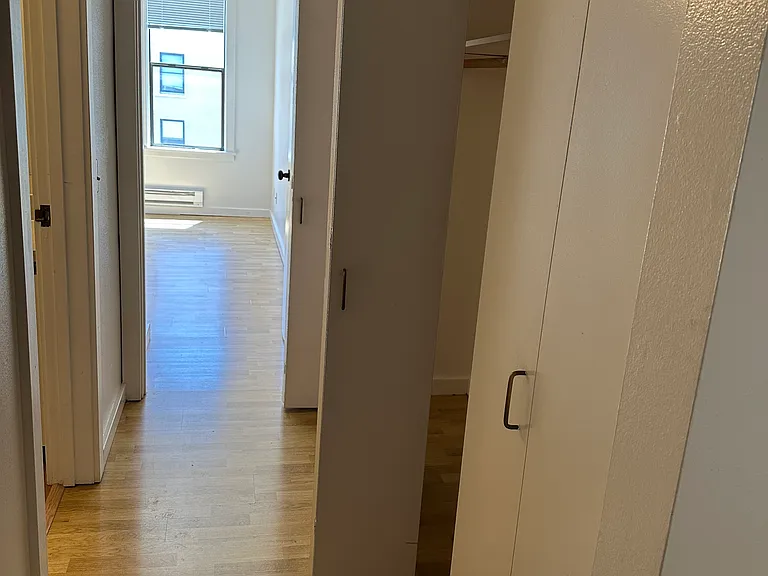 Hallway to bedroom, bathroom and abundant storage