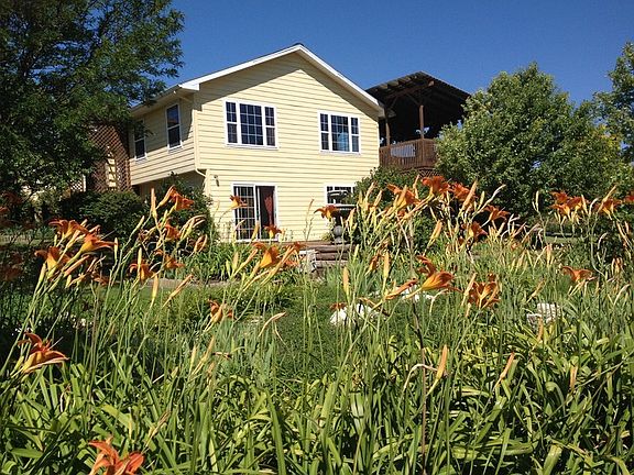 Sunny, cheerful country garden home
						:
						3 bdrm/3bath with central AC and heat, attached two car garage/shop