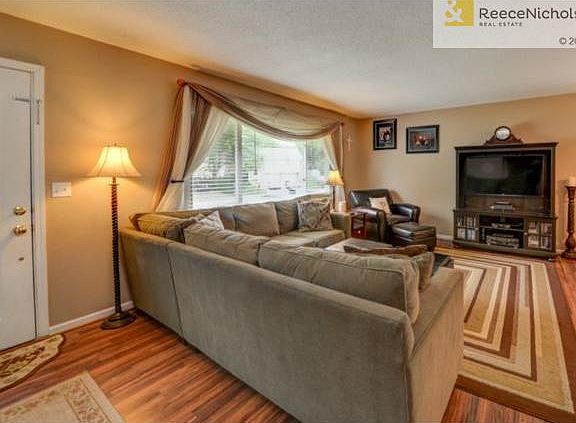 You enter into a nice size family room with laminate flooring an