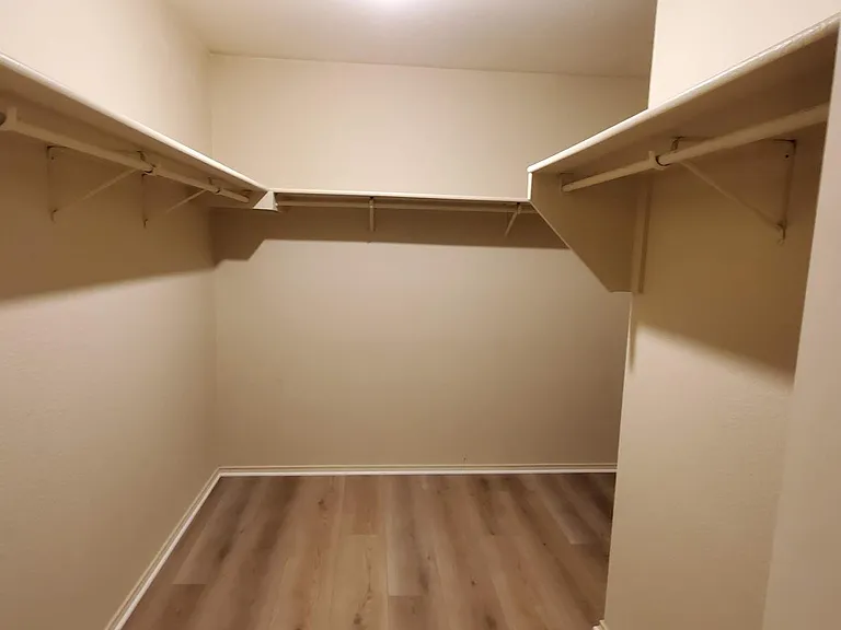 Main bedroom walk-in closet actually wraps around the corner and keeps going