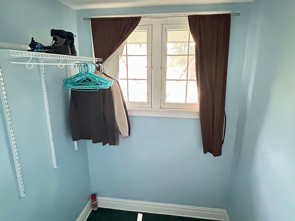 stairwell to third floor, with extra hanging storage space