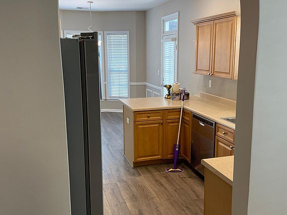 VIEW OF KITCHEN FROM DEN