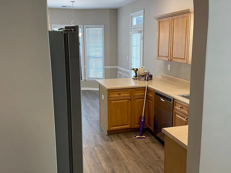 VIEW OF KITCHEN FROM DEN