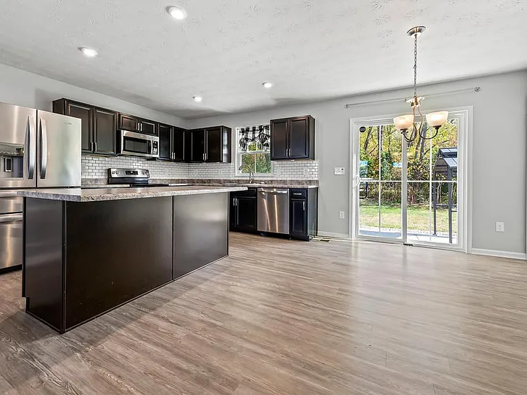 Kitchen and Dining Area with Sneak Peek of the Backyard.