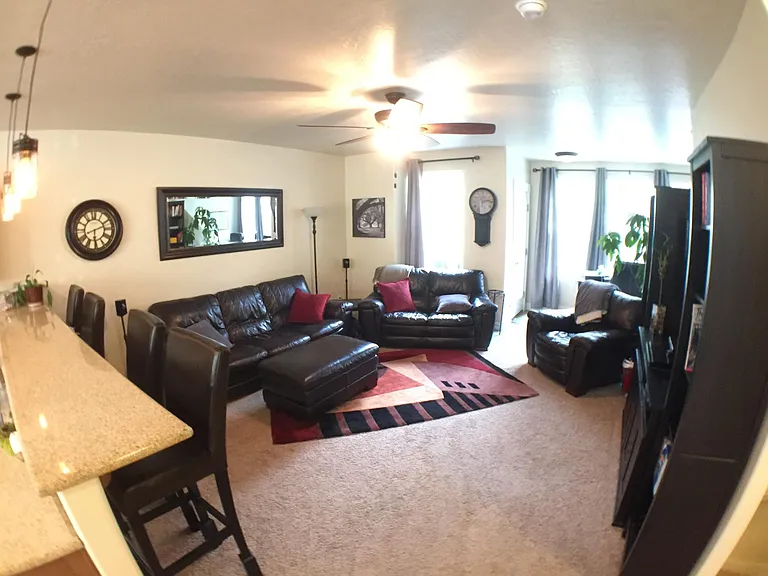 Photo before the flooring was replaced -- showing an example of the furnished living room.