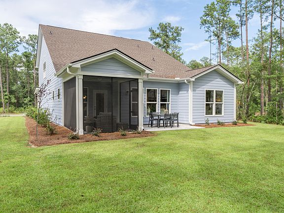 Screen porch with patio and large backyard. - Model Representation