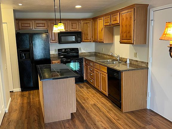 Nicely decorated kitchen with access to laundry, powder bathroom, attached garage and private back patio.