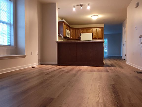 Dining area viewing kitchen and living room beyond