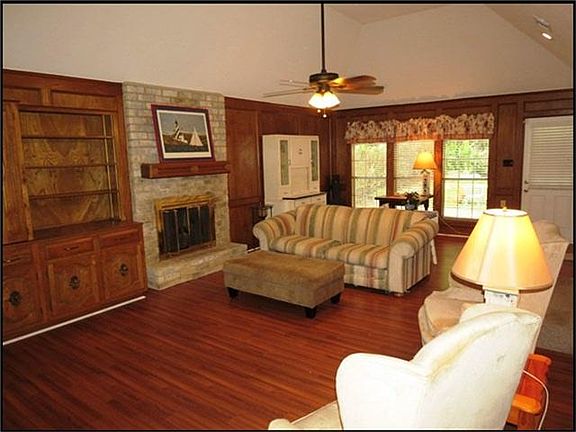 STEP DOWN INTO THIS SPACIOUS FAMILY ROOM WITH BUILT-INS.