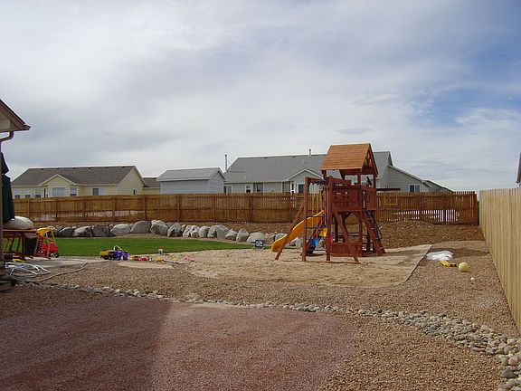 Right side of home looking West to back yard