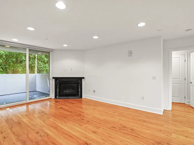 Living Room with Electric Fireplace and Patio