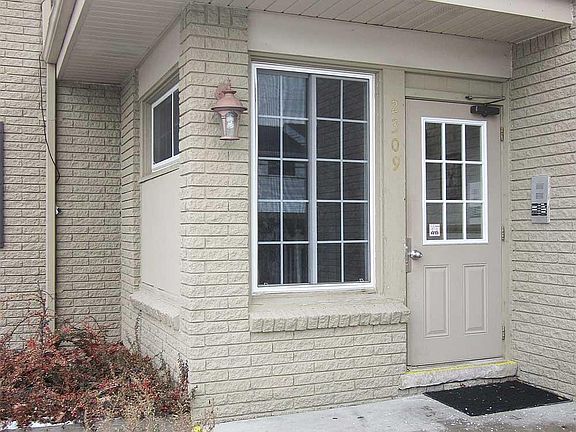 Building Rear Entrance - view from Carport.