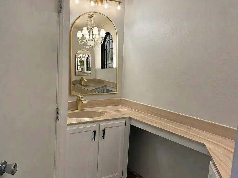 This is a dual sink bathroom (other sink is on the right) Currently remodeling this primary bathroom to add new light fixtures, faucets, and mirrors. Photo represents the new improvements ( improvements not exact but very similar)