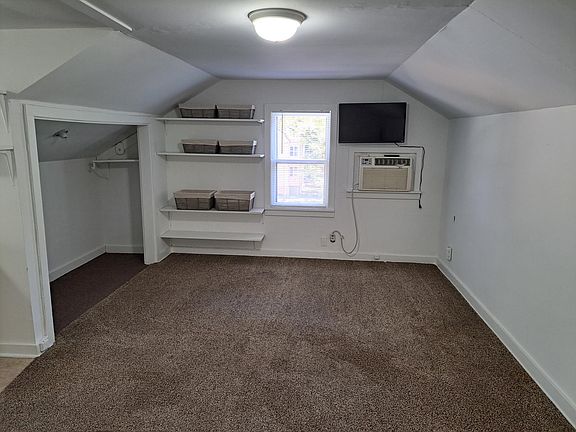 Living area. Great shelving for storage. Large closet space.