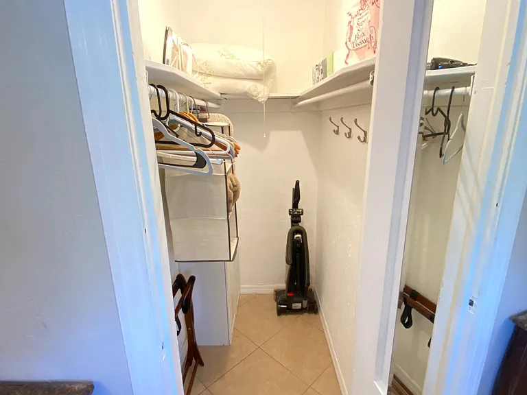 Walk in closet located in bedroom