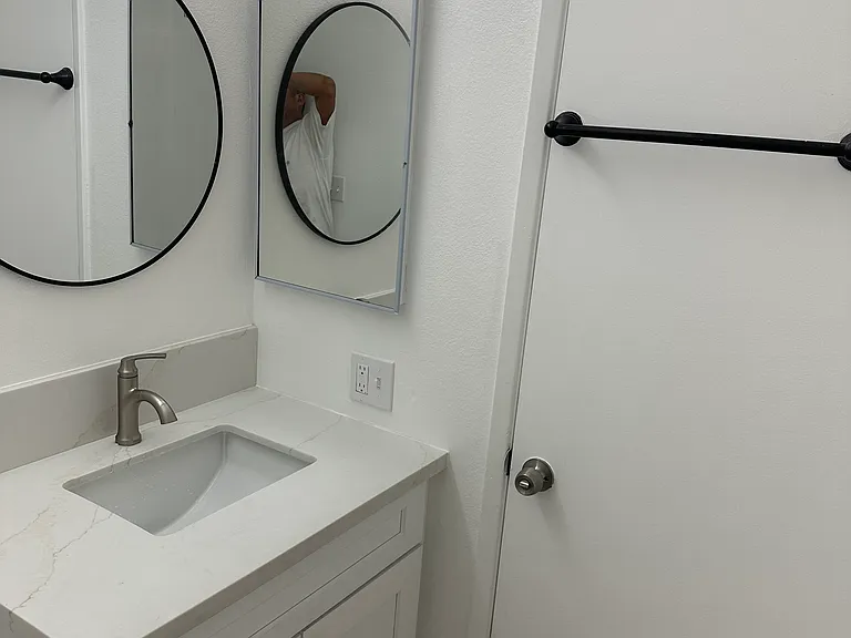 New vanity, sink, marble, and mirror
