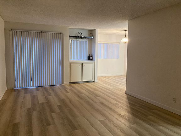 Living area with sliding door to a small open balcony.